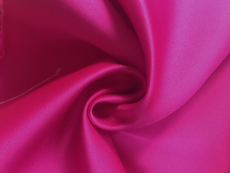 magenta double face poly satin in swirl
