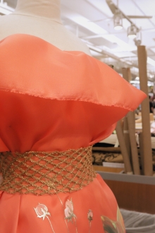 Sample Mannequin in the B&J Fabrics Showroom with Peach Silk Gazar and Metallic Netting