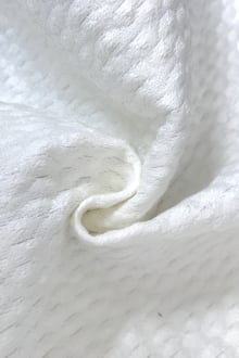 Italian Cotton and Nylon Blend Brocade in White in a swirl to show texture